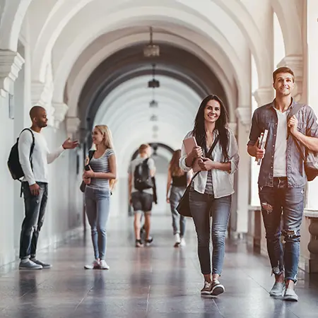 a group of people walking in a hallway