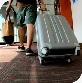 a person pulling a suitcase