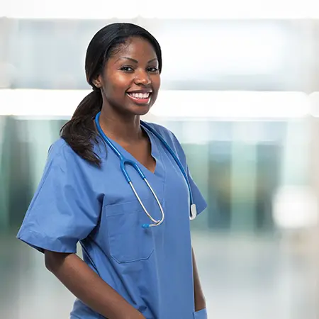 a woman wearing a blue scrubs